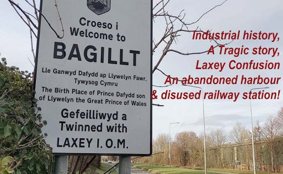 Road sign shows that Bagillt is twinned with Laxey, Isle of Man